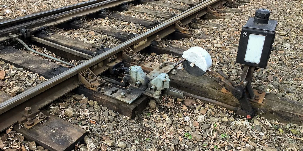 A hand-operated railroad switch that sends a train down one of two tracks